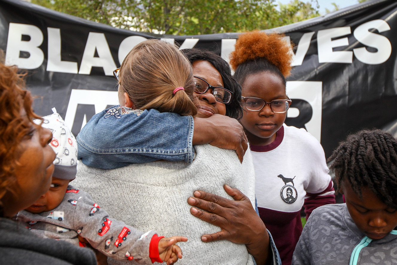 Family members of Patrick Harmon receive hugs from supporters at the rally demanding justice in the man's officer-involved shooting death in August at the Public Safety Building in Salt Lake City on Saturday, Sept. 30, 2017. (Photo: Adam Fondren, KSL)