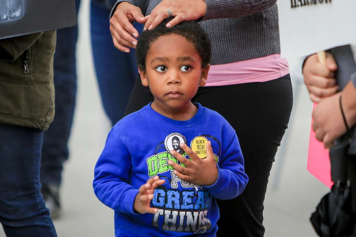 Omari Hopoate plays with his protest buttons during a rally demanding justice in the officer-involved shooting death of Patrick Harmon in August at the Public Safety Building in Salt Lake City on Saturday, Sept. 30, 2017. (Photo: Adam Fondren, KSL)