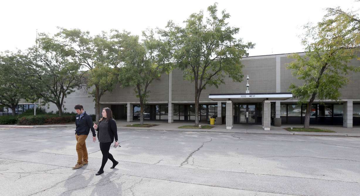 Denver Lough, CEO of PolarityTE, and Courtney Cushnir, operations manager, leave PolarityTE's future headquarters in West Jordan on Thursday, Sept. 28, 2017. The company announced it will take over the Fairchild Semiconductor property. (Photo: Kristin Murphy, KSL)