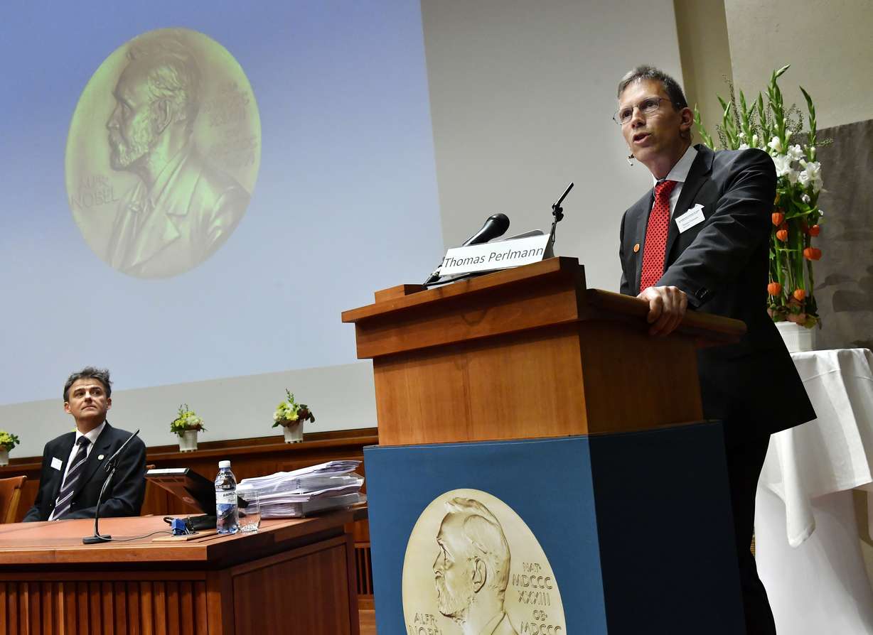 Thomas Perlmann, Chariman of the Nobel Committee of Medicine, announces the winners of the 2017 Nobel Prize for Medicine during a press conference at the Nobel Forum in Stockholm, Monday Oct. 2, 2017. (AP Photo/Jonas Ekstromer)