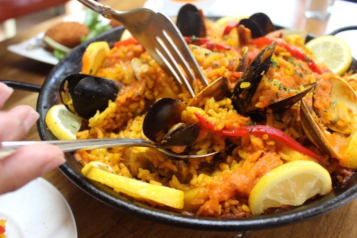 Paella brings together rice, seafood, vegetables, saffron and other spices simmered in a pan until golden brown. (Photo: Yvette Cruz, KSL.com)