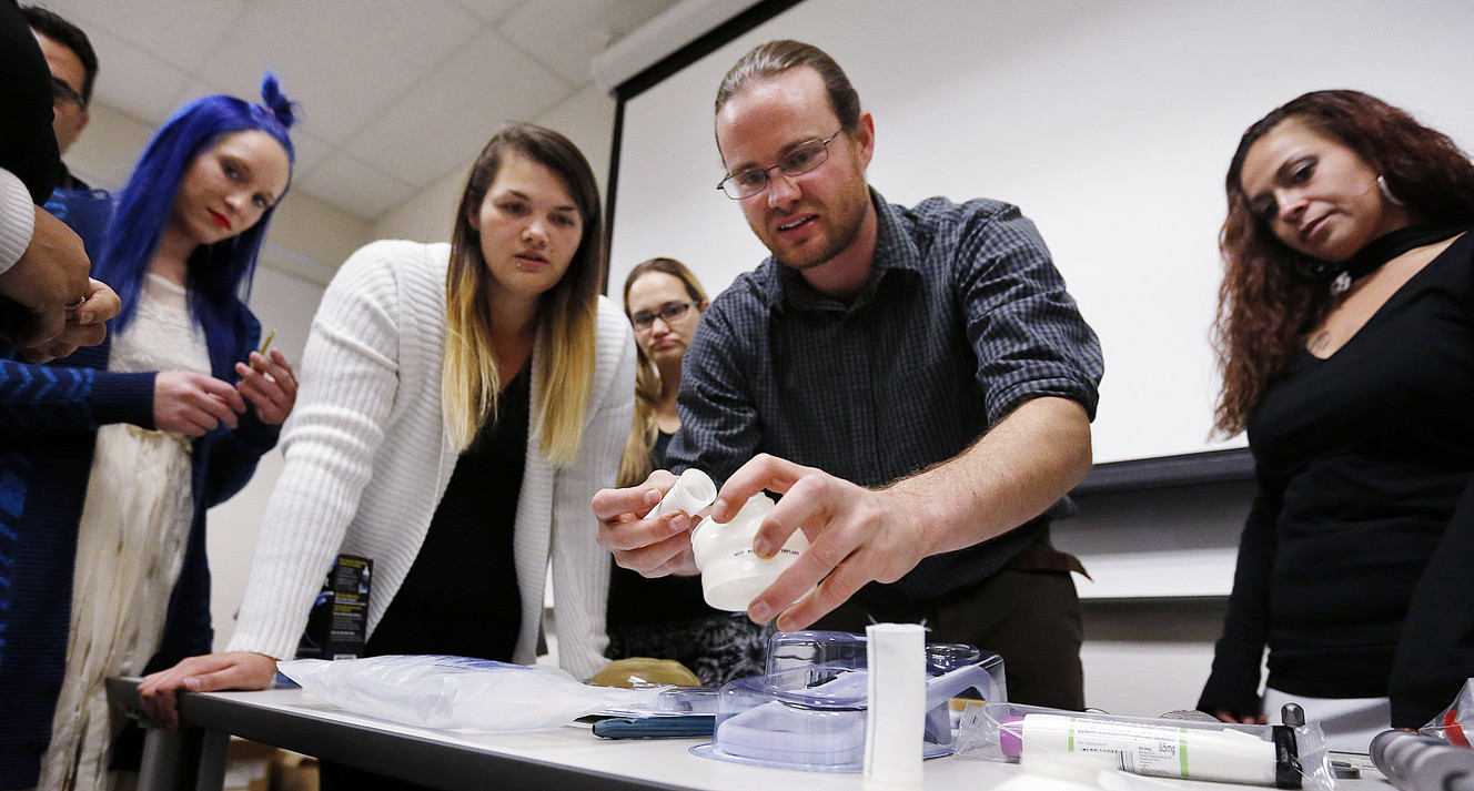 Teacher Kevin R. Buckingham shows medical equipment to single moms during the Invest in You Too program at Salt Lake Community College in Sandy on Monday, Oct. 2, 2017. The Department of Workforce Services’ program is a 13-week course that helps single mothers build skills in medical manufacturing and job readiness to open doors for employment. (Photo: Ravell Call, KSL)