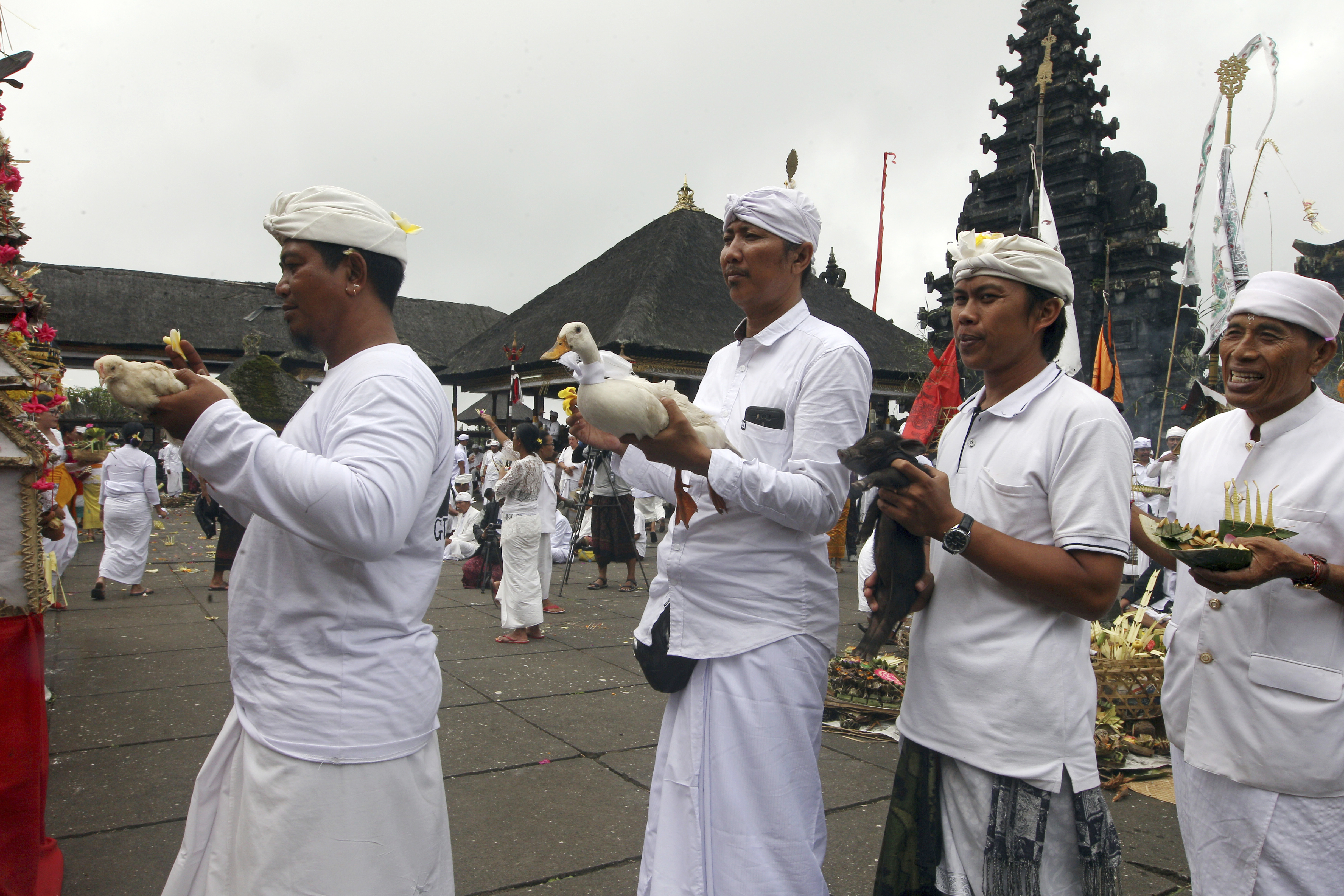 Dozens pray at Hindu temple on slopes of Bali volcano
