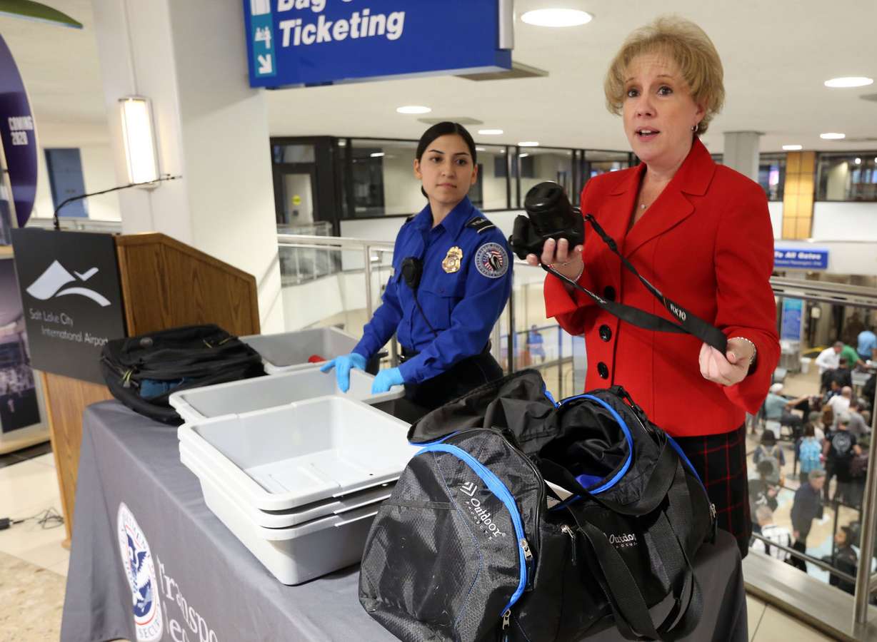 Lorie Dankers, affairs manager for the Transportation Security Administration, demonstrates what items will need to be pulled out of bags for new carry-on screening procedures. Photo: Kristin Murphy, KSL