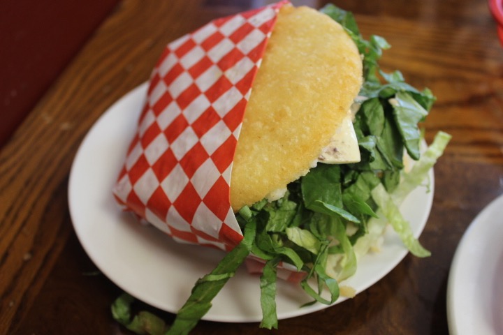 At Andinitas, 4139 Carriage Square in Salt Lake City, the arepa de pollo includes chicken, shredded lettuce, tomatoes, onions and some sauce. (Yvette Cruz, KSL.com)