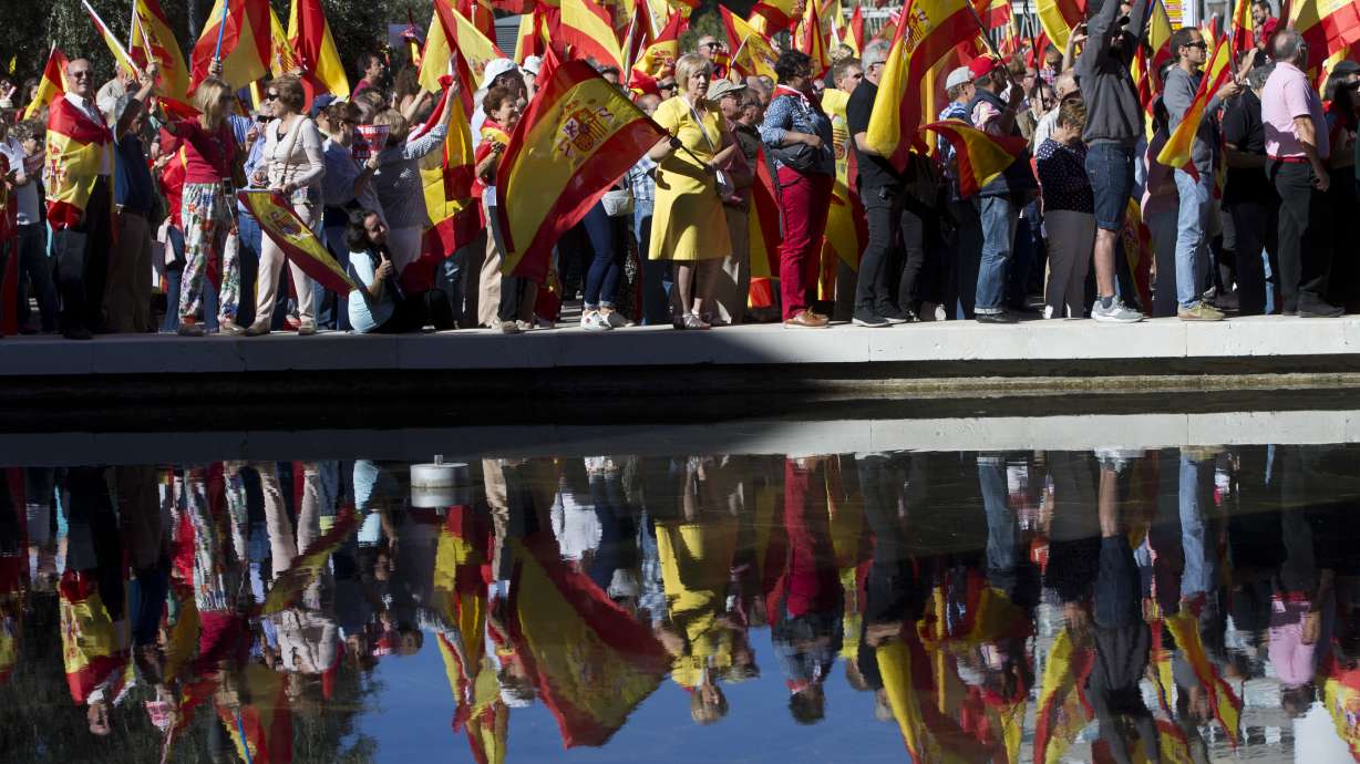 The Latest: Spain minister warns of Catalan business exodus