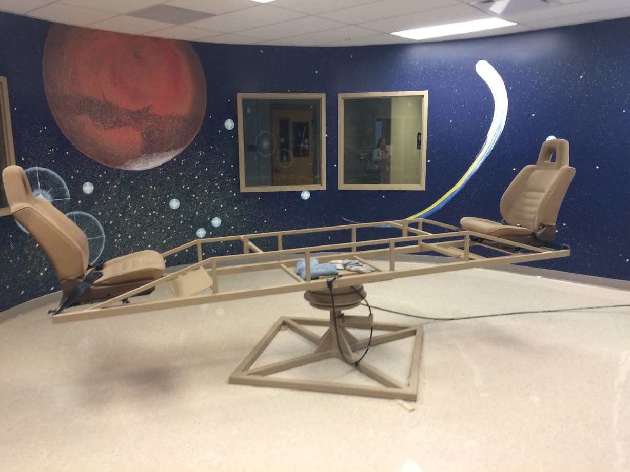 The Astro Camp's "Newton Chair" teaches camp attendees and students about Newton's Laws of Motion and is one of the camp's attractions which will be open to the public Monday night.