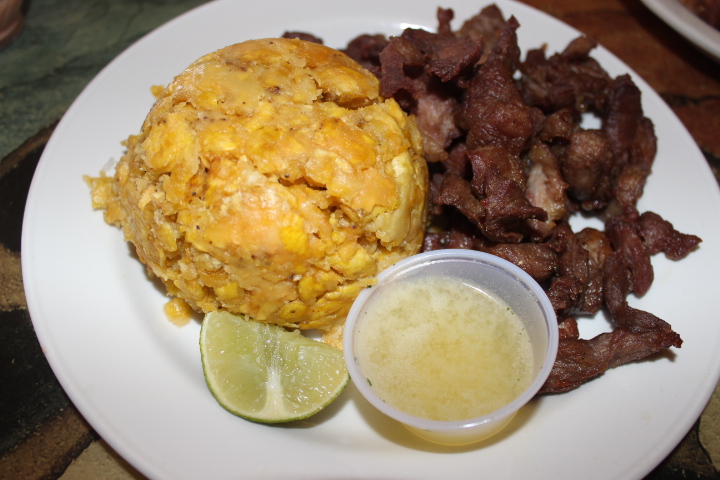 At El Tropical, the mofongo de carnita frita (mofongo with fried pork) is hot and crispy. If the fried plantains are a bit too dry for one’s taste, a small cup of chicken broth is served on the side so you can give your mofongo a bit more moisture and taste. (Photo: Yvette Cruz, KSL.com)
