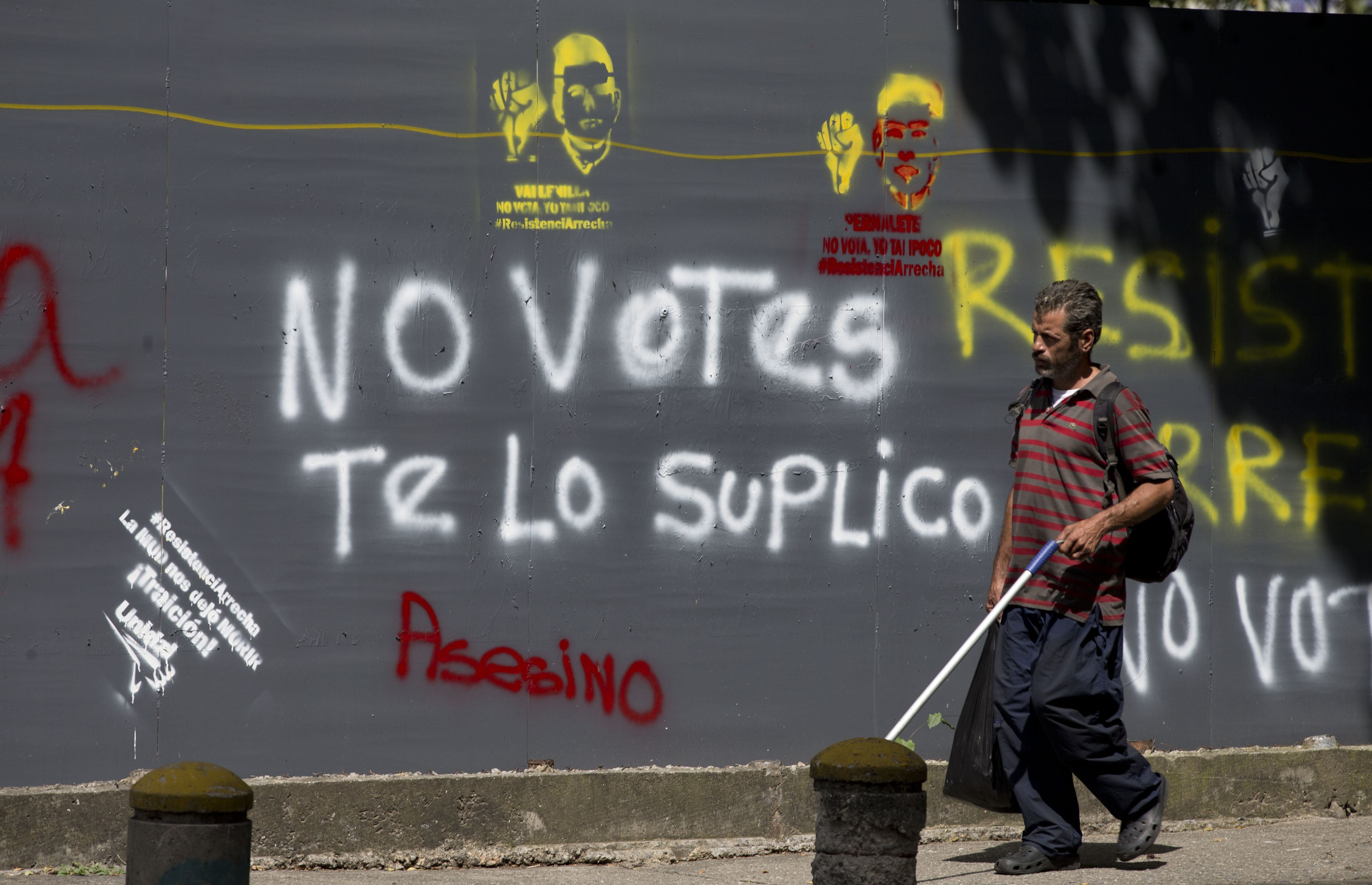 The Latest: Venezuela ruling party wins most governor races