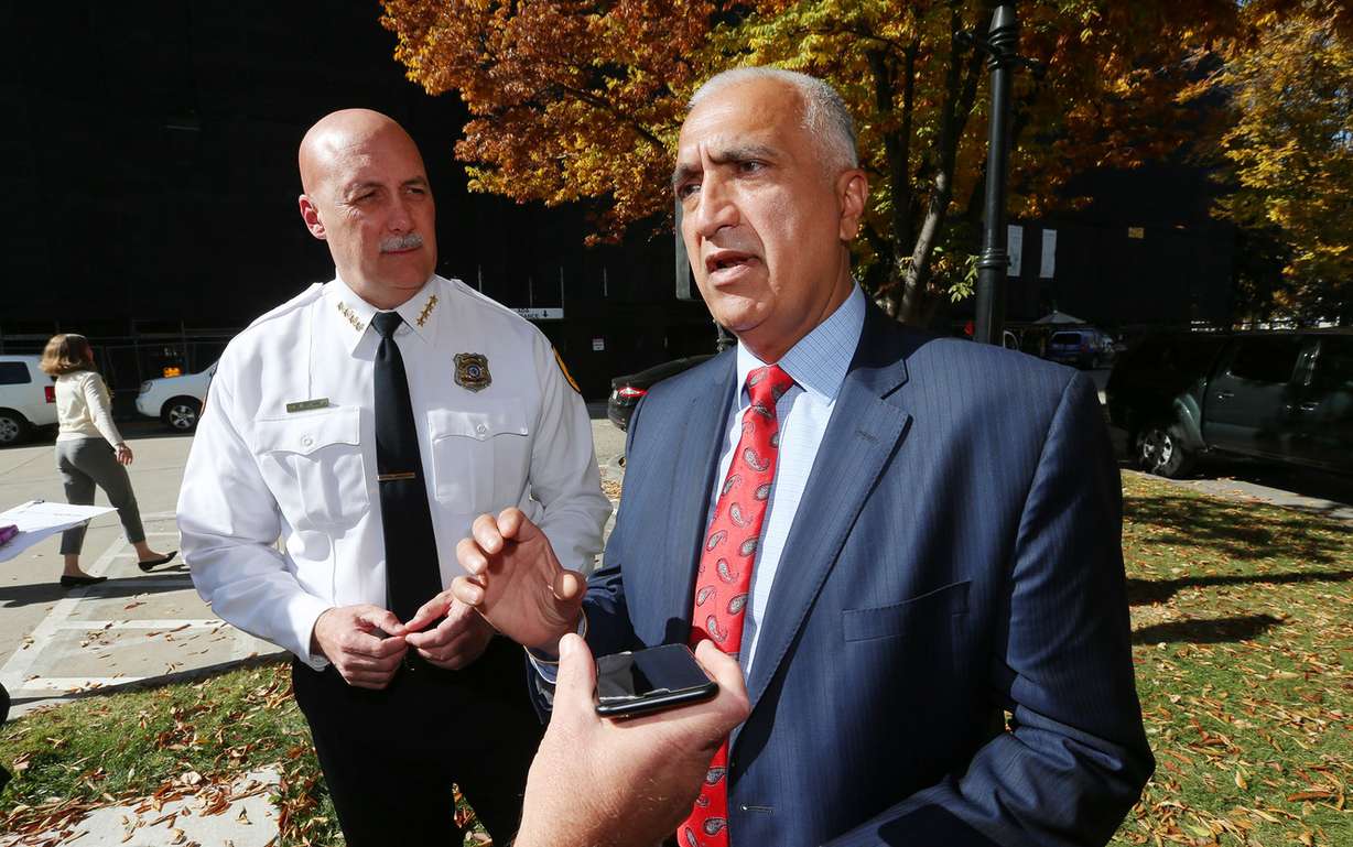 Salt Lake City Police Chief Mike Brown watches and Salt Lake County District Attorney Sim Gill discusses Salt Lake City Mayor Jackie Biskupski's executive order governing the release of body camera footage from the Salt Lake City Police Department during a press conference at the Salt Lake City-County Building on Tuesday, Oct. 17, 2017. (Photo: Scott G Winterton, KSL)