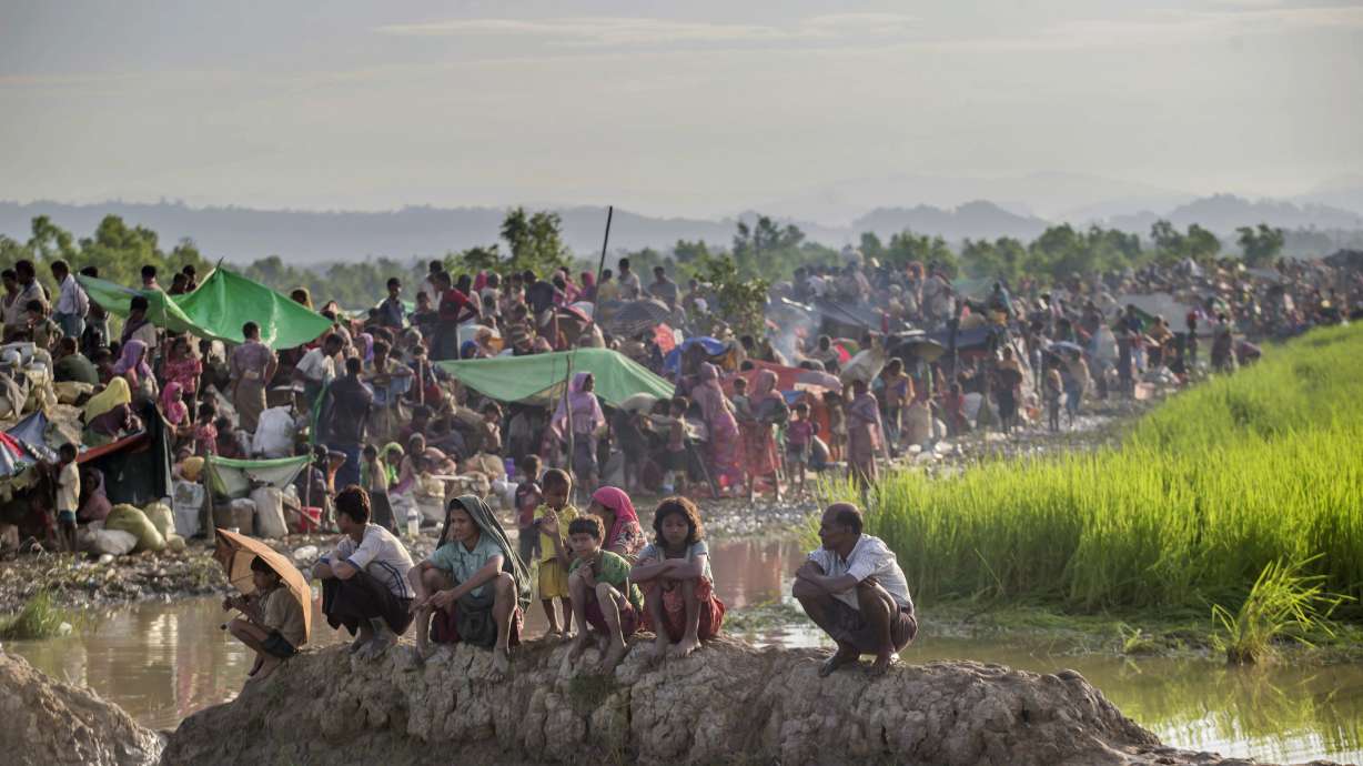 The Latest: Amnesty says Myanmar killed 100s of Rohingya