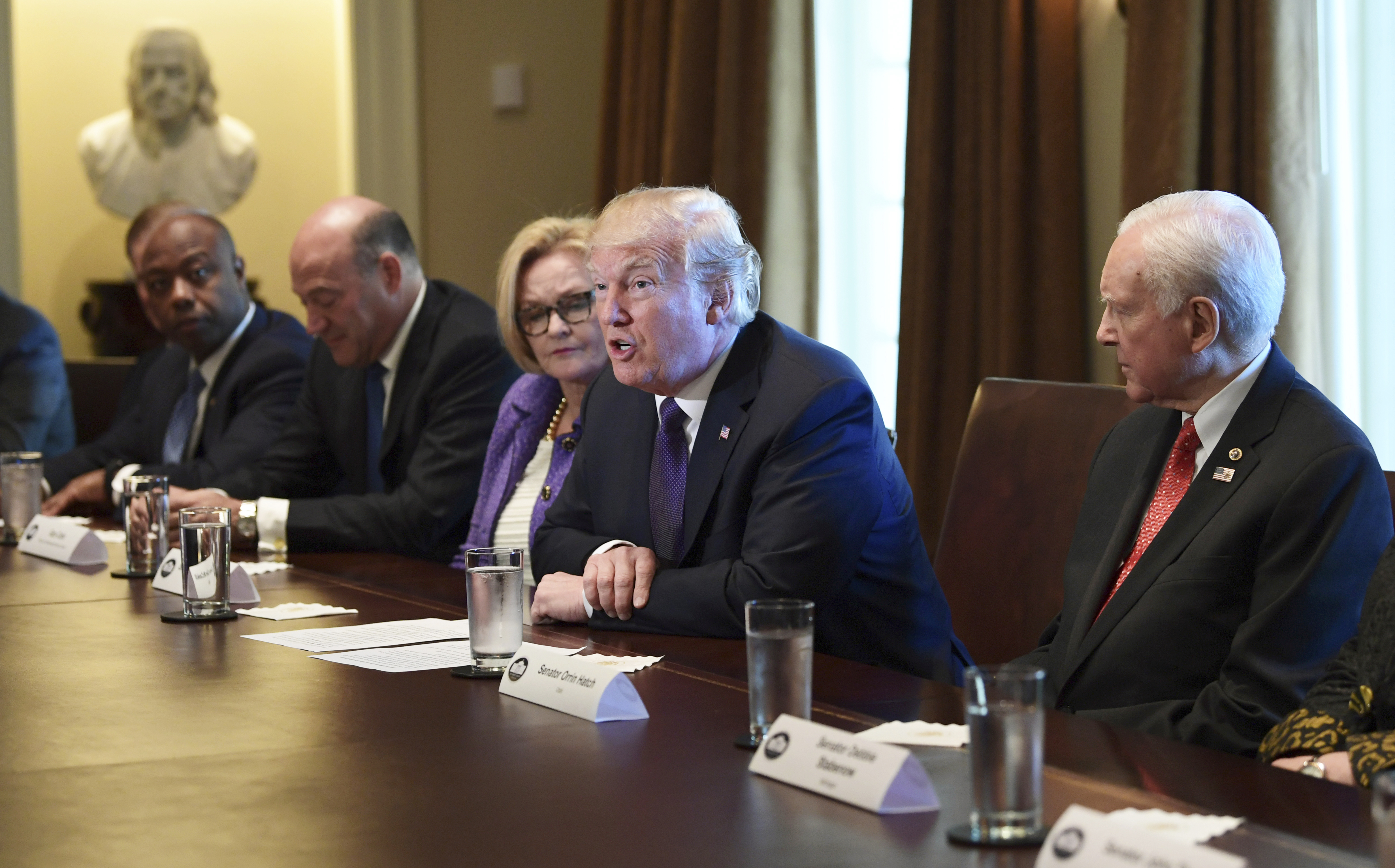 The Latest: Trump warns Democrats about opposing tax plan