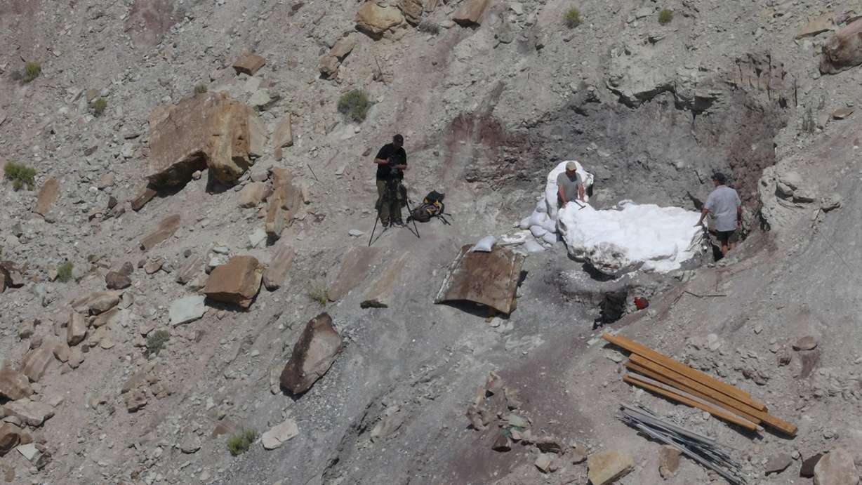 The team working on the excavation of the block of Utahraptor fossils at a site near Moab. (Photo: Jim Kirkland)