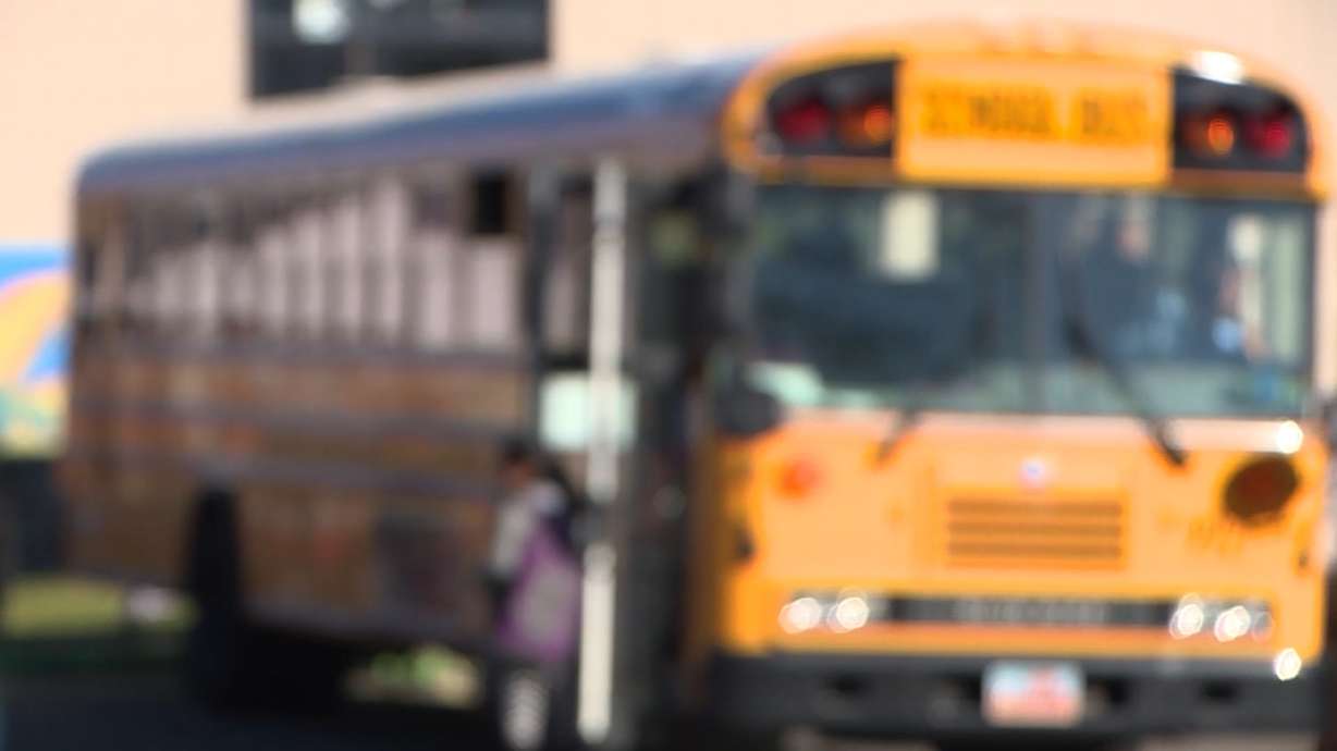 Children board buses at Roosevelt Elementary School in South Salt Lake on Tuesday, Oct. 24, 2017. blurred