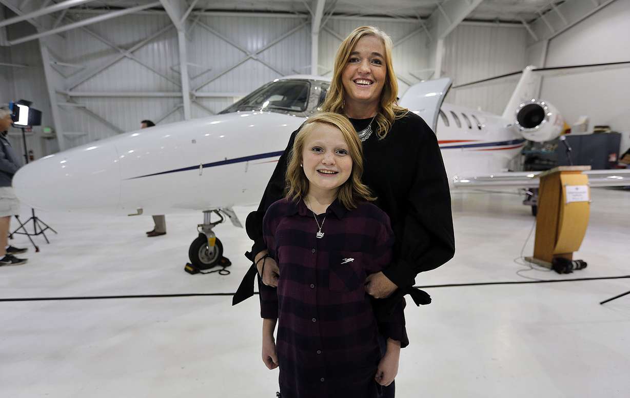 Kina Jewkes, a Primary Children's Hospital liver transplant recipient, poses for a photo with her mother, Jennifer, as Intermountain Healthcare introduces a new Life Flight jet in Salt Lake City on Monday, Oct. 30, 2017. The jet will be used primarily to retrieve organs for transplantation in the Intermountain West. (Photo: Ravell Call, KSL)