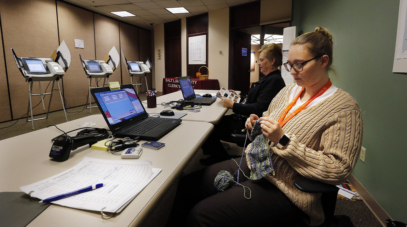 Election judge Zoe Holstay knits while waiting for voters during early voting at the Salt Lake County Government Center in Salt Lake City on Tuesday, Oct. 31, 2017. Behind her is election judge Jeanette Clark. (Photo: Ravell Call, KSL)