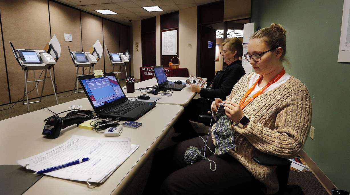 Election judge Zoe Holstay knits while waiting for voters during early voting at the Salt Lake County Government Center in Salt Lake City on Tuesday, Oct. 31, 2017. Behind her is election judge Jeanette Clark. (Photo: Ravell Call, KSL)
