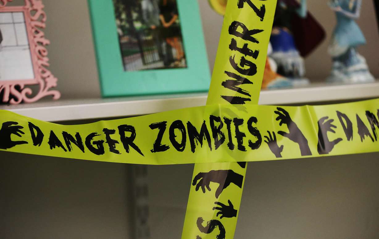 West Point Junior High students work to solve math problems to “escape zombies” in West Point on Tuesday, Oct. 31, 2017. (Photo: Jeffrey D. Allred, KSL)