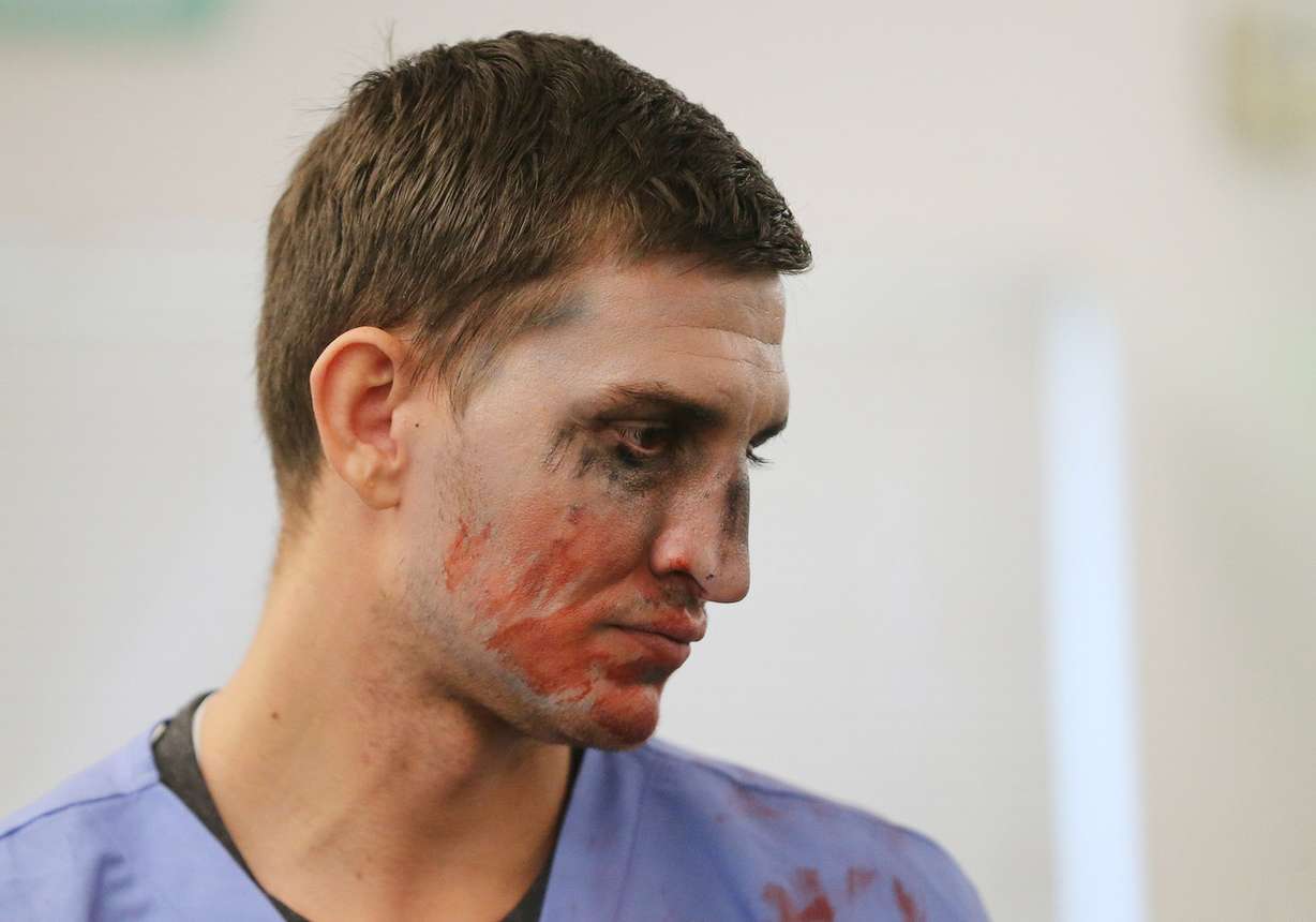 Volunteer zombie Casey Oliverson watches as West Point Junior High students work to solve math problems to “escape zombies” in West Point on Tuesday, Oct. 31, 2017. (Photo: Jeffrey D. Allred, KSL)