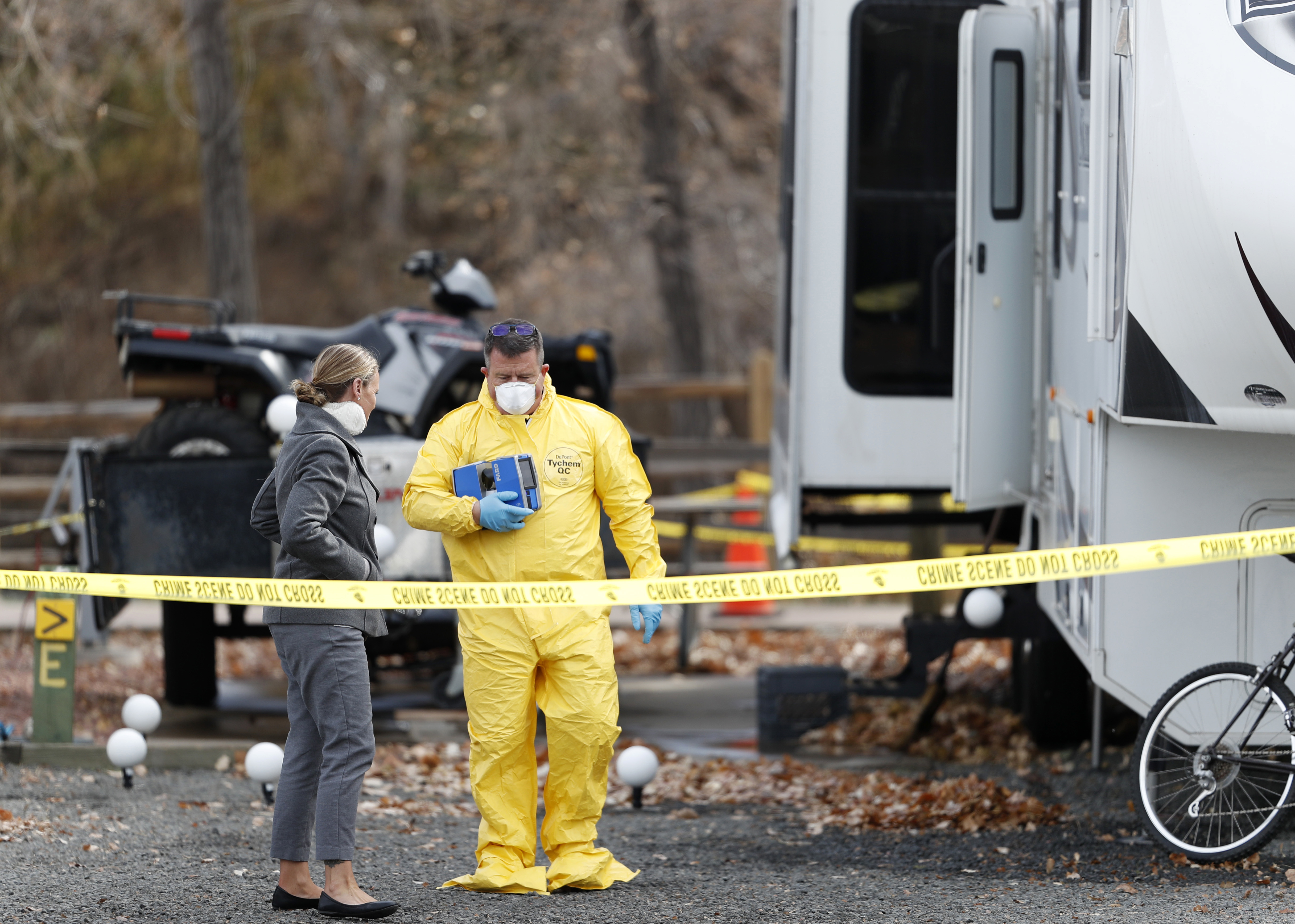The Latest: Police: Gunman tried to drag woman up canyon