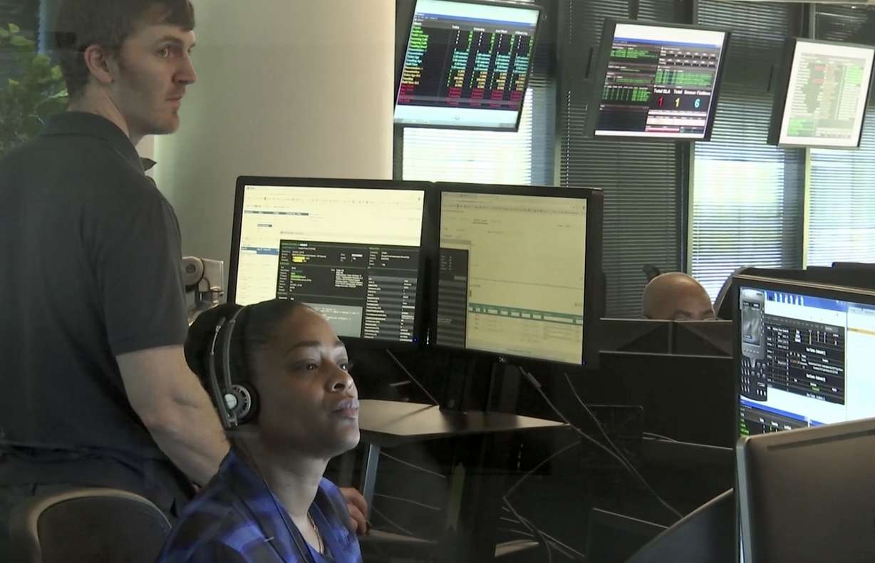 Seen though an interior window, employees work in the offices of Secureworks in Atlanta on Oct. 4, 2017. Photo: Marina Hutchinson, AP Photo