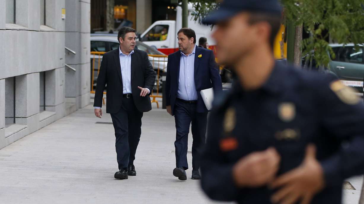 Spain judge jails Catalan ministers, mulls leader's arrest