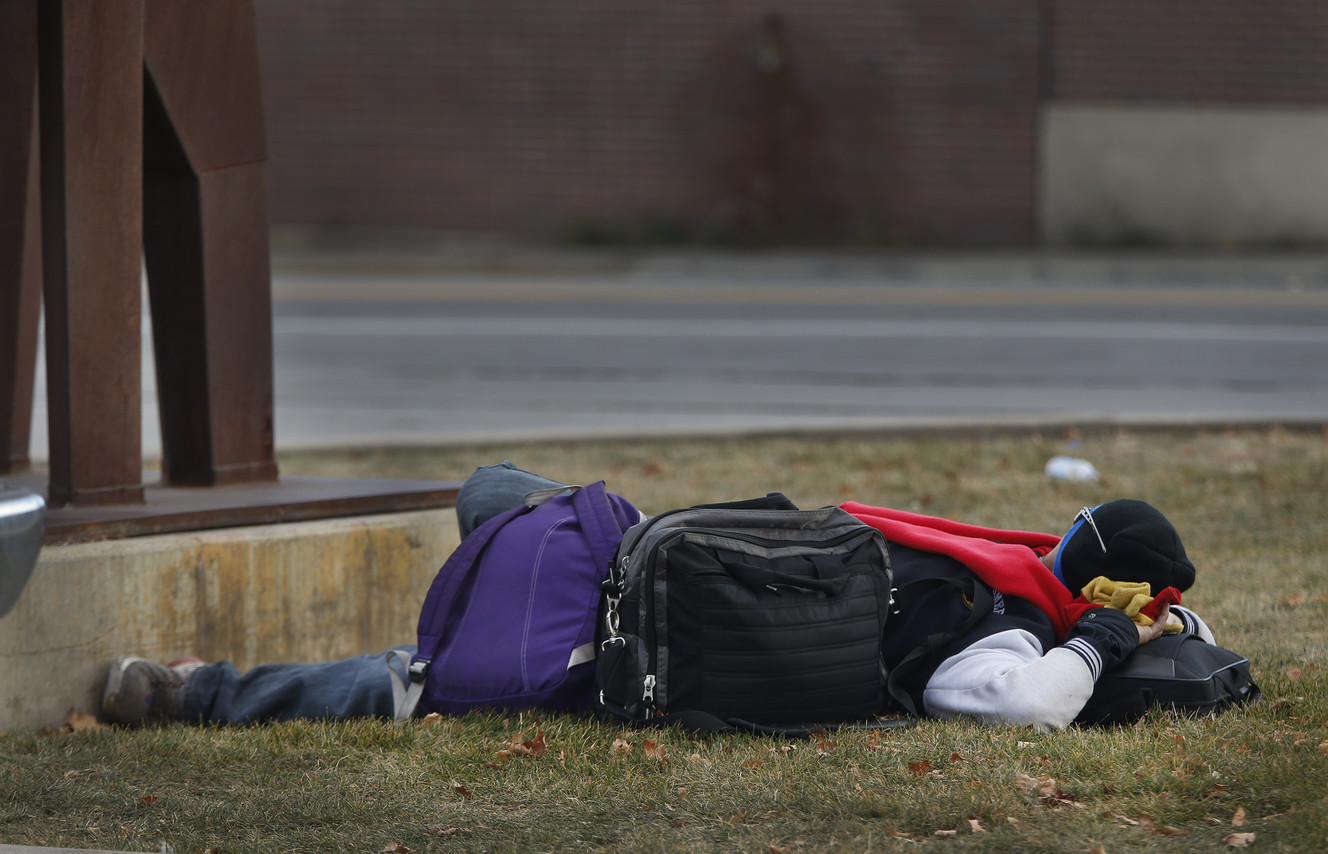 A homeless man sleeps near the TRAX station on 1300 South in Salt Lake City on Thursday, Nov. 2, 2017. Photo: Jeffrey D. Allred, KSL