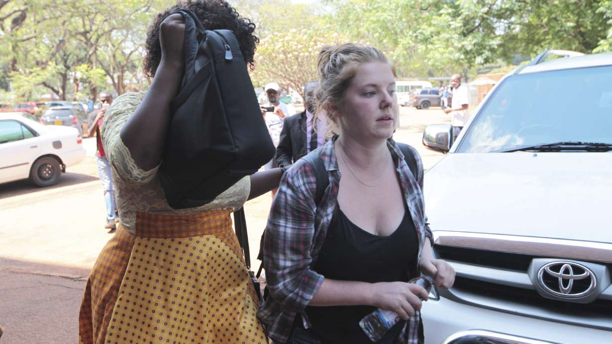 The Latest: American accused in Zimbabwe to stay in jail