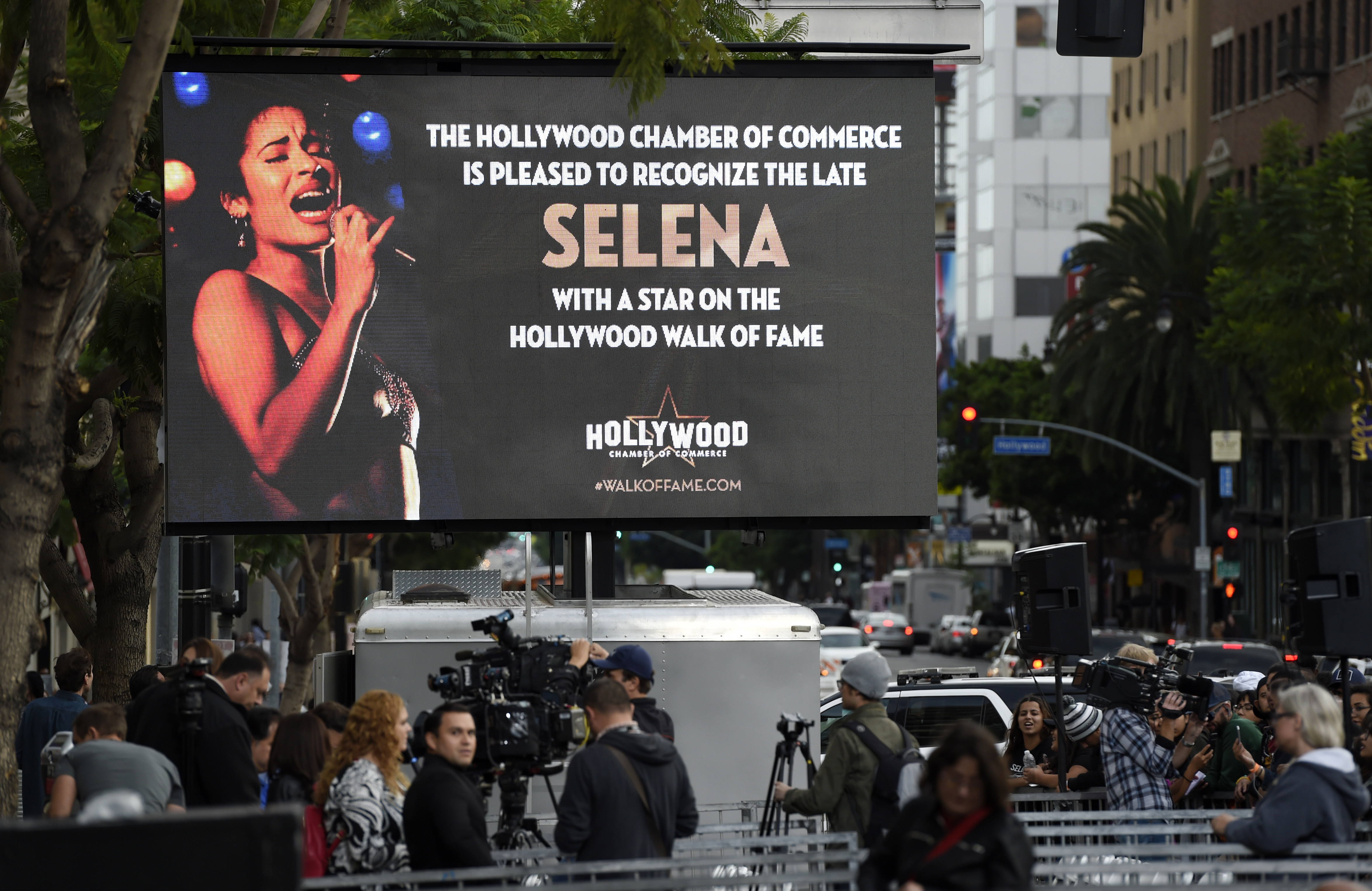 A video screen advertises a ceremony to award the late singer Selena Quintanilla a posthumous star on the Hollywood Walk of Fame on Friday, Nov. 3, 2017, in Los Angeles. (Photo by Chris Pizzello/Invision/AP)