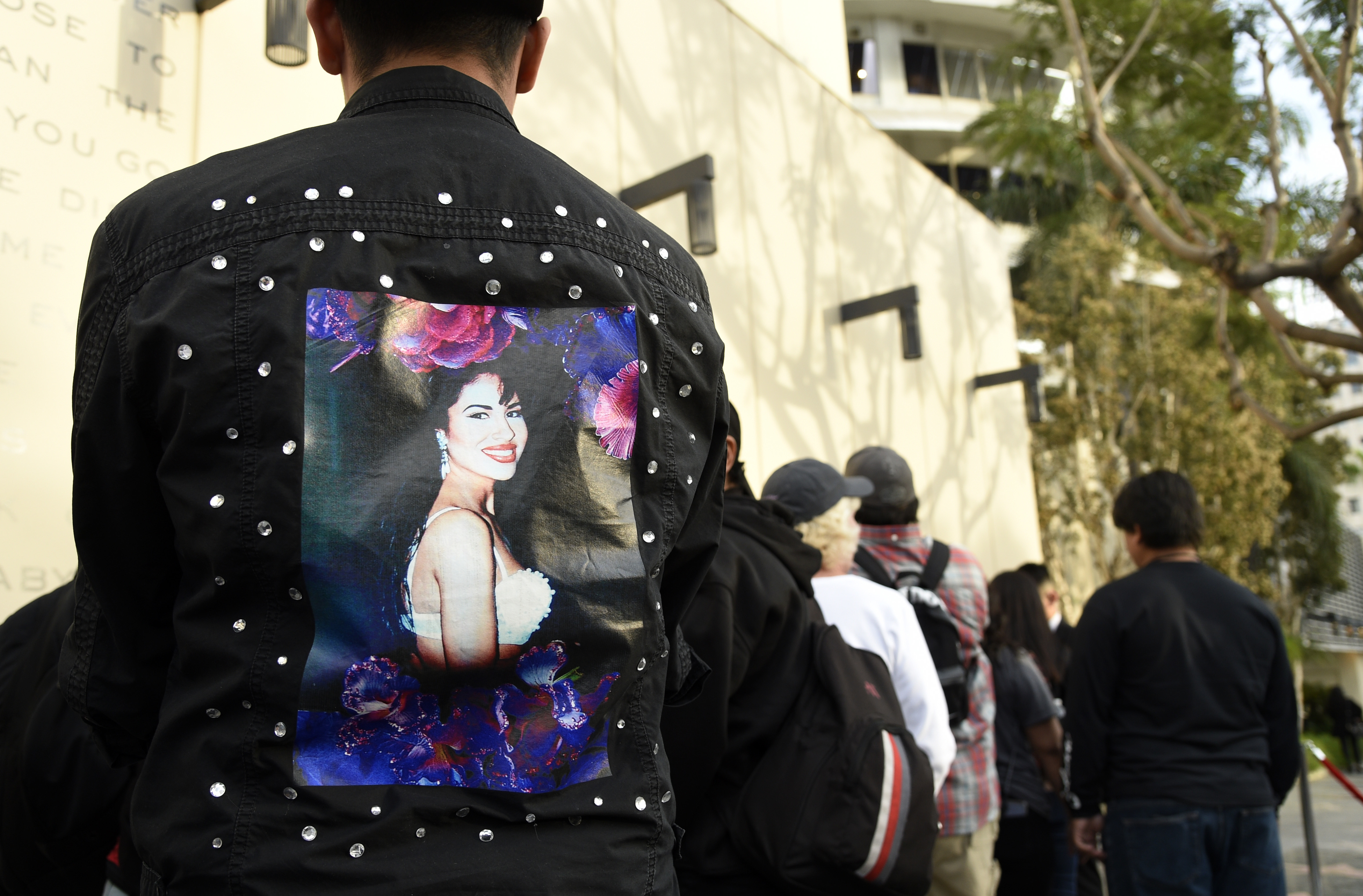 Fans of the late singer Selena Quintanilla wait in line to attend a ceremony to award her a posthumous star on the Hollywood Walk of Fame on Friday, Nov. 3, 2017, in Los Angeles. (Photo by Chris Pizzello/Invision/AP)