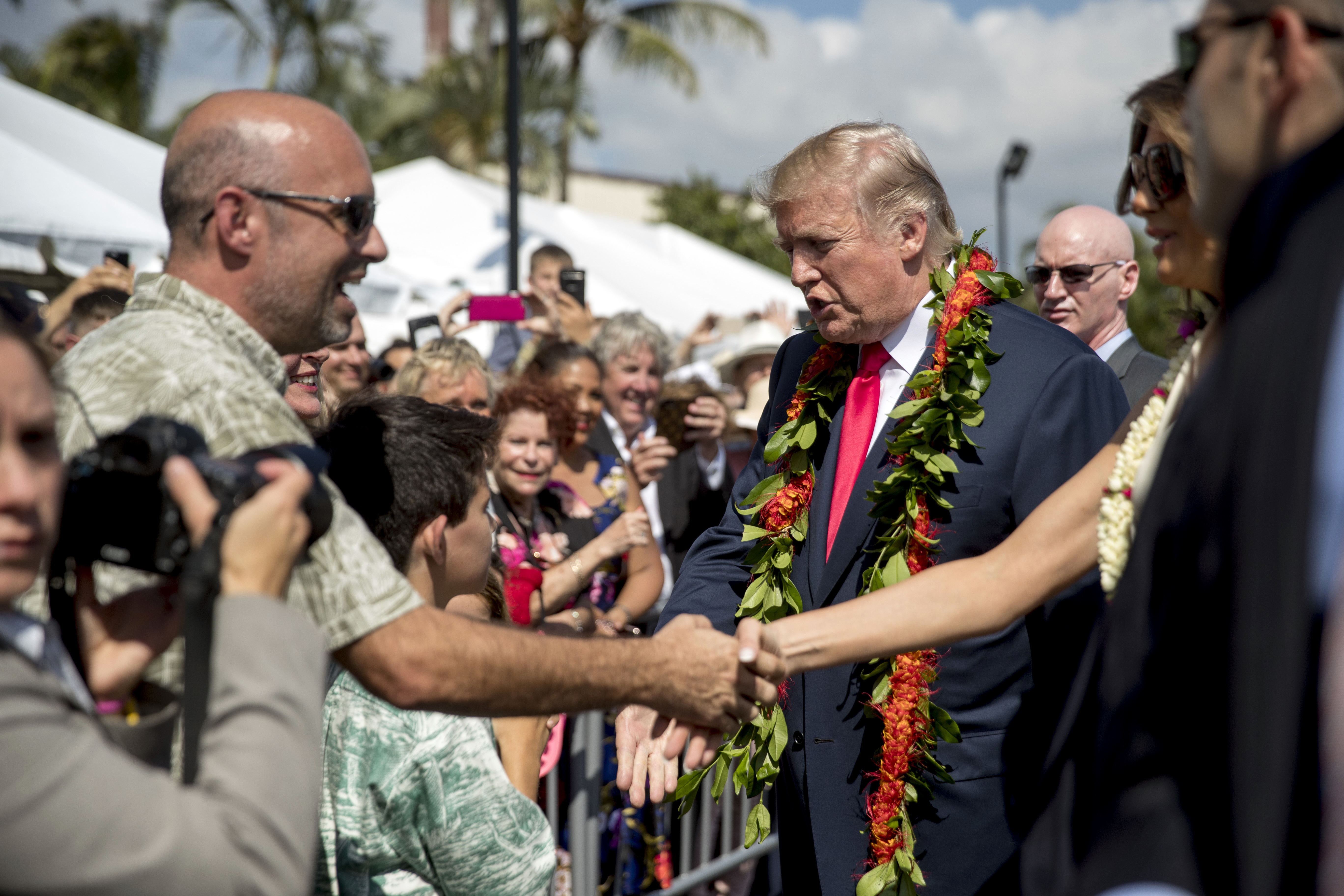 The Latest: President makes stop at Trump hotel in Honolulu