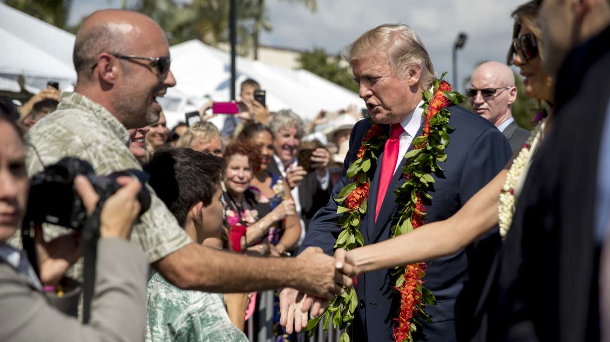 The Latest: President makes stop at Trump hotel in Honolulu
