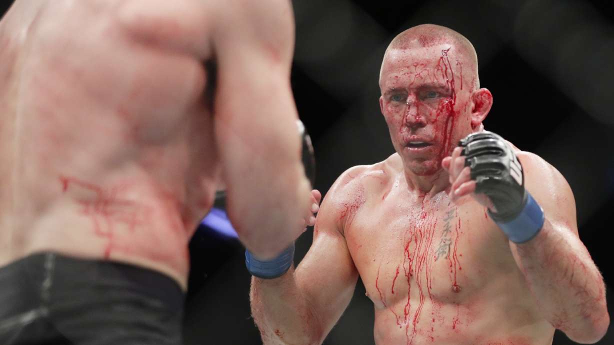 St. Pierre wins UFC title fight to cap night of new champs