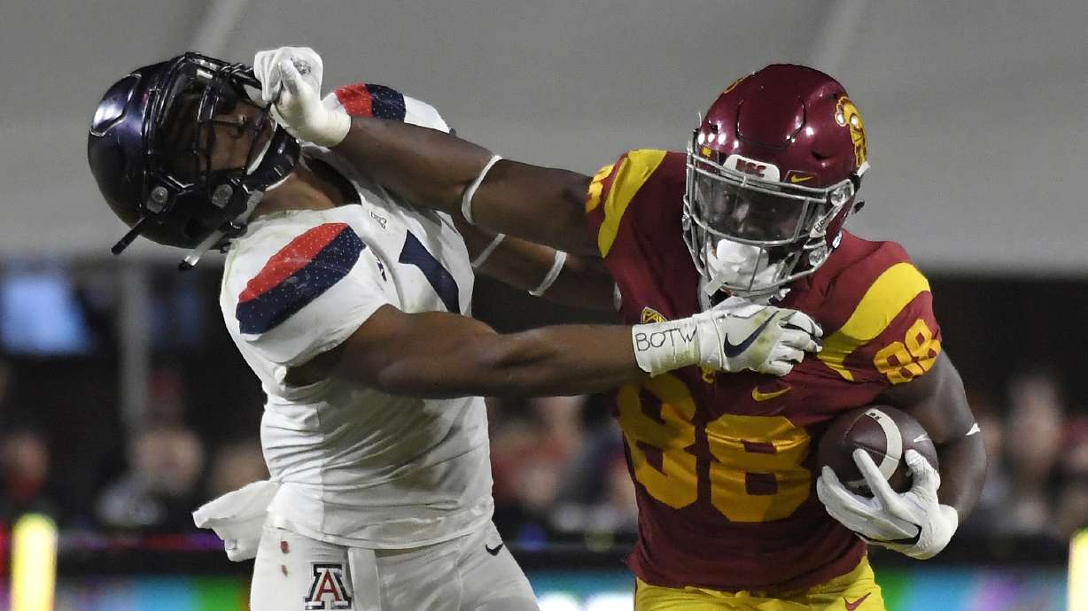Jones runs wild late, No. 17 USC beats No. 23 Arizona 49-35