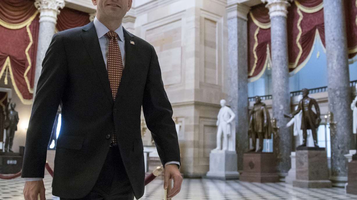 The Latest: House panel backs late changes to tax proposal
