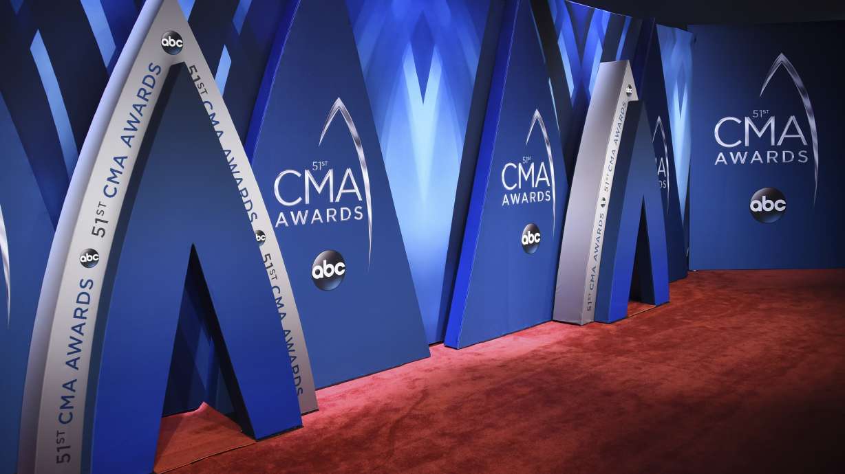 The Latest: Urban debuts new song at CMA Awards