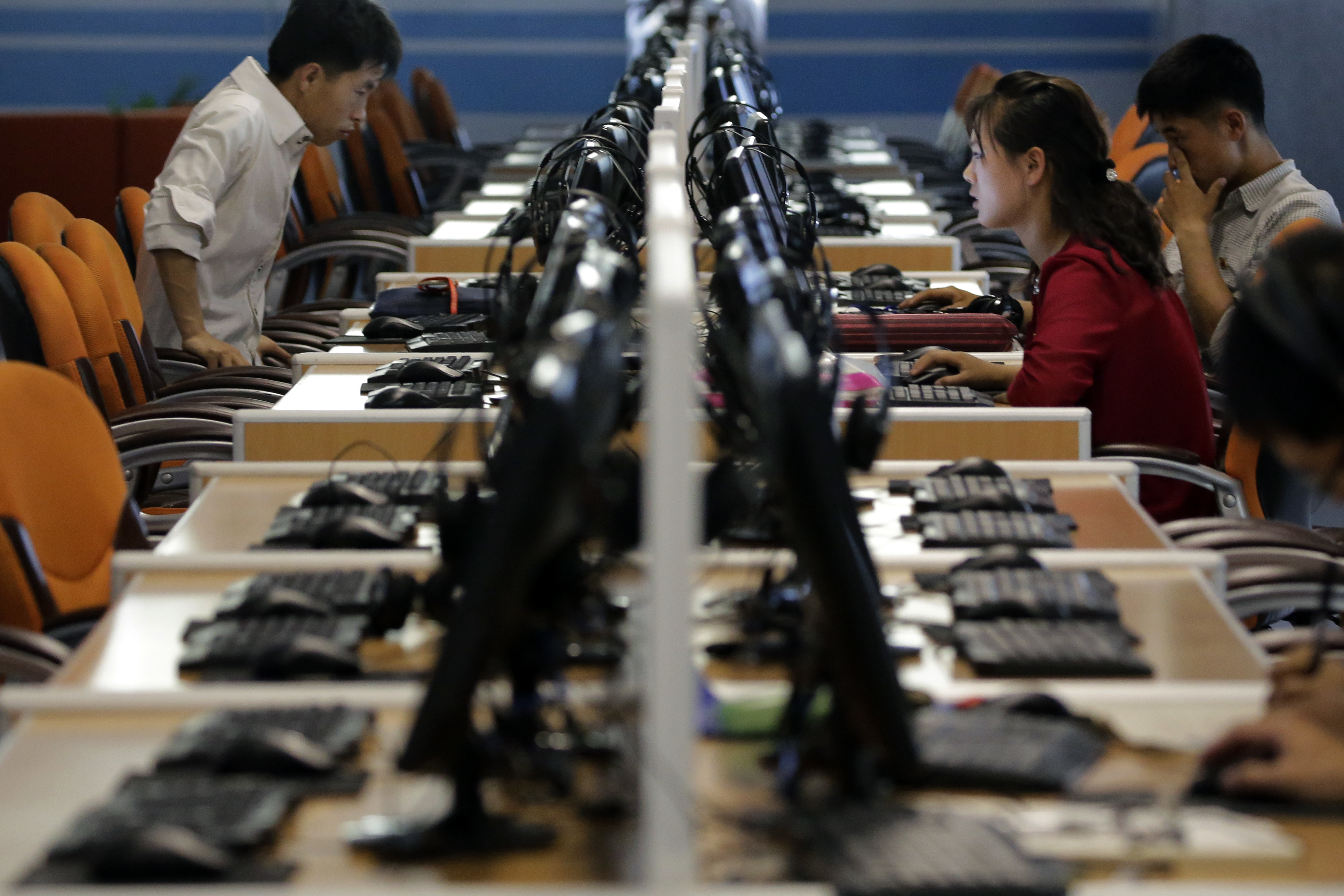 In this June 16, 2017, photo, North Korean men and women use computer terminals at the Sci-Tech Complex in Pyongyang, North Korea. Photo: Wong Maye-E, AP Photo