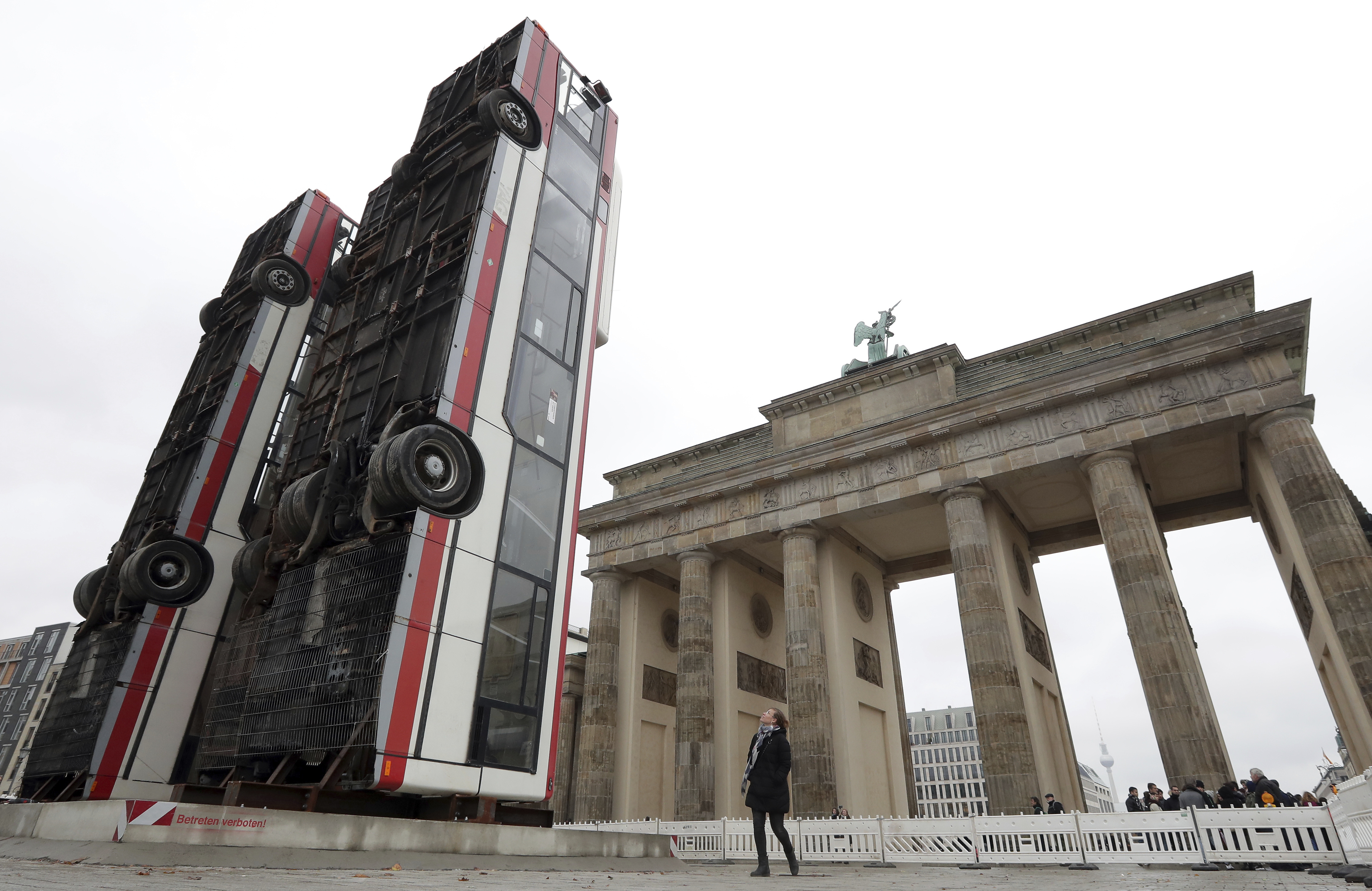 Buses upended in Berlin evoke suffering of Syrian refugees