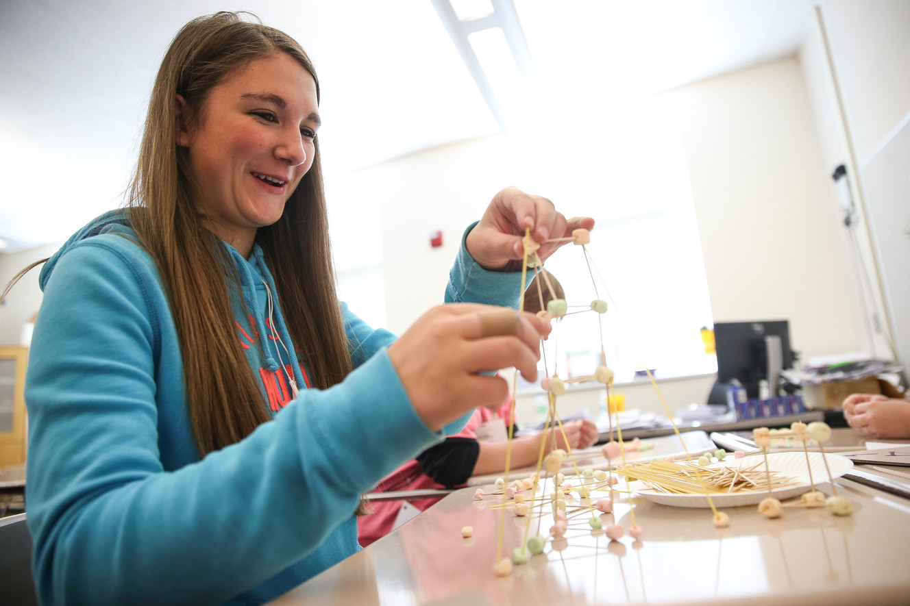 Tatiana Hadfield builds a tower from marshmallows and pasta at the Expanding Your Horizons Conference at North Davis Junior High in Clearfield on Saturday, Nov. 11, 2017. (Photo: Spenser Heaps, KSL)