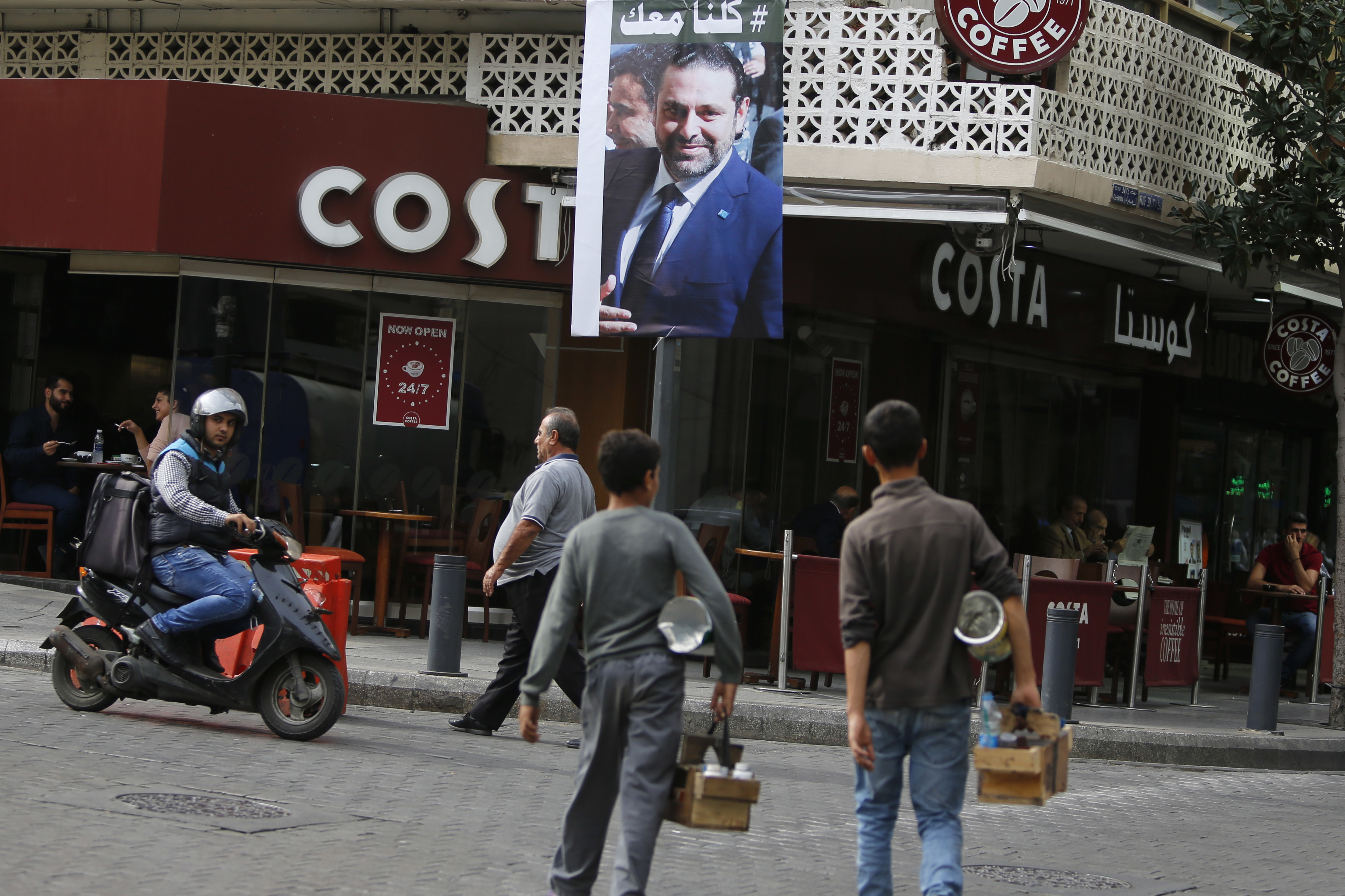Resigned PM tells Lebanese to 'chill,' says he's coming home