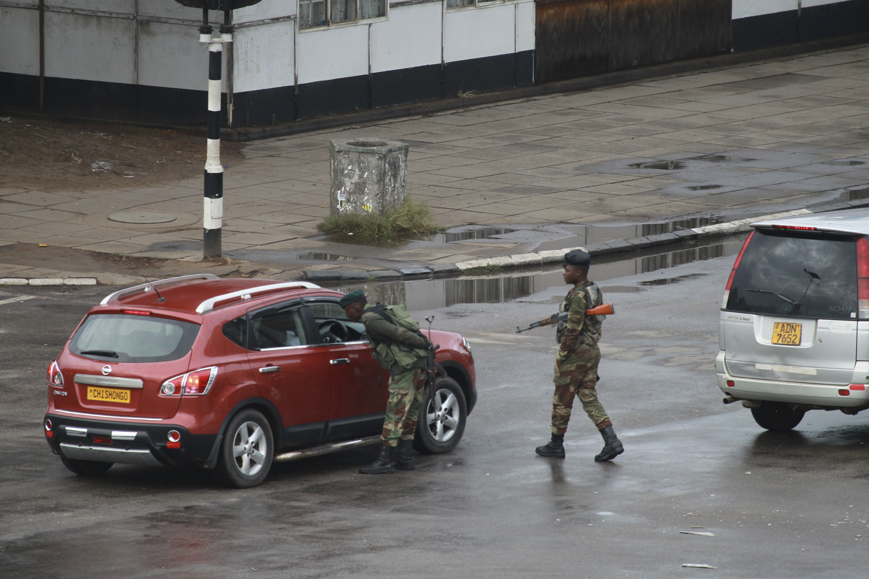 The Latest: Zimbabwe youth leader apologizes to army leaders