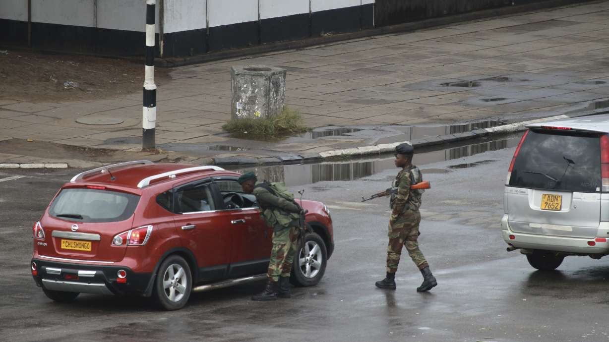 The Latest: Zimbabwe youth leader apologizes to army leaders
