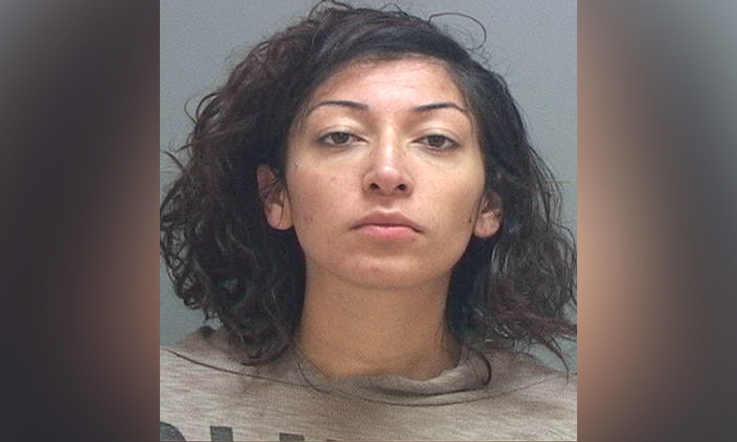 Woman arrested in connection with stabbing of neighbor