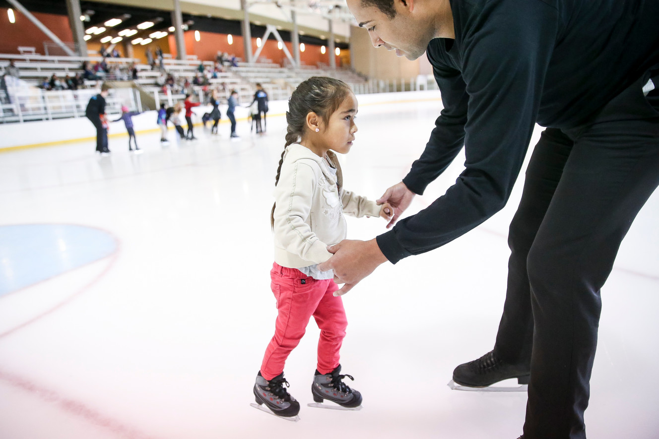 Gene Holmes helps Adalyn Valdez, 4, while skating at the South Davis Recreation Center in Bountiful on Wednesday, Nov. 15, 2017. To mark the upcoming Disney On Ice show in Salt Lake City, professional skaters from the show gave lessons to children from the Utah Foster Care Foundation. (Photo: Spenser Heaps, KSL)