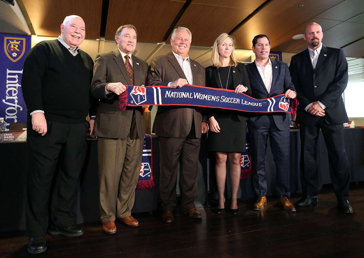 Sandy City Mayor Tom Dolan, Gov. Gary Herbert, Real Salt Lake owner Dell Loy Hansen, National Women's Soccer League managing director Amanda Duffy, Real Salt Lake chief business officer Andy Carroll and Real Salt Lake general manager Craig Waibel, pose for a photo after announcing a new NWSL team to play in Utah at Rio Tinto Stadium in Sandy on Thursday, Nov. 16, 2017.