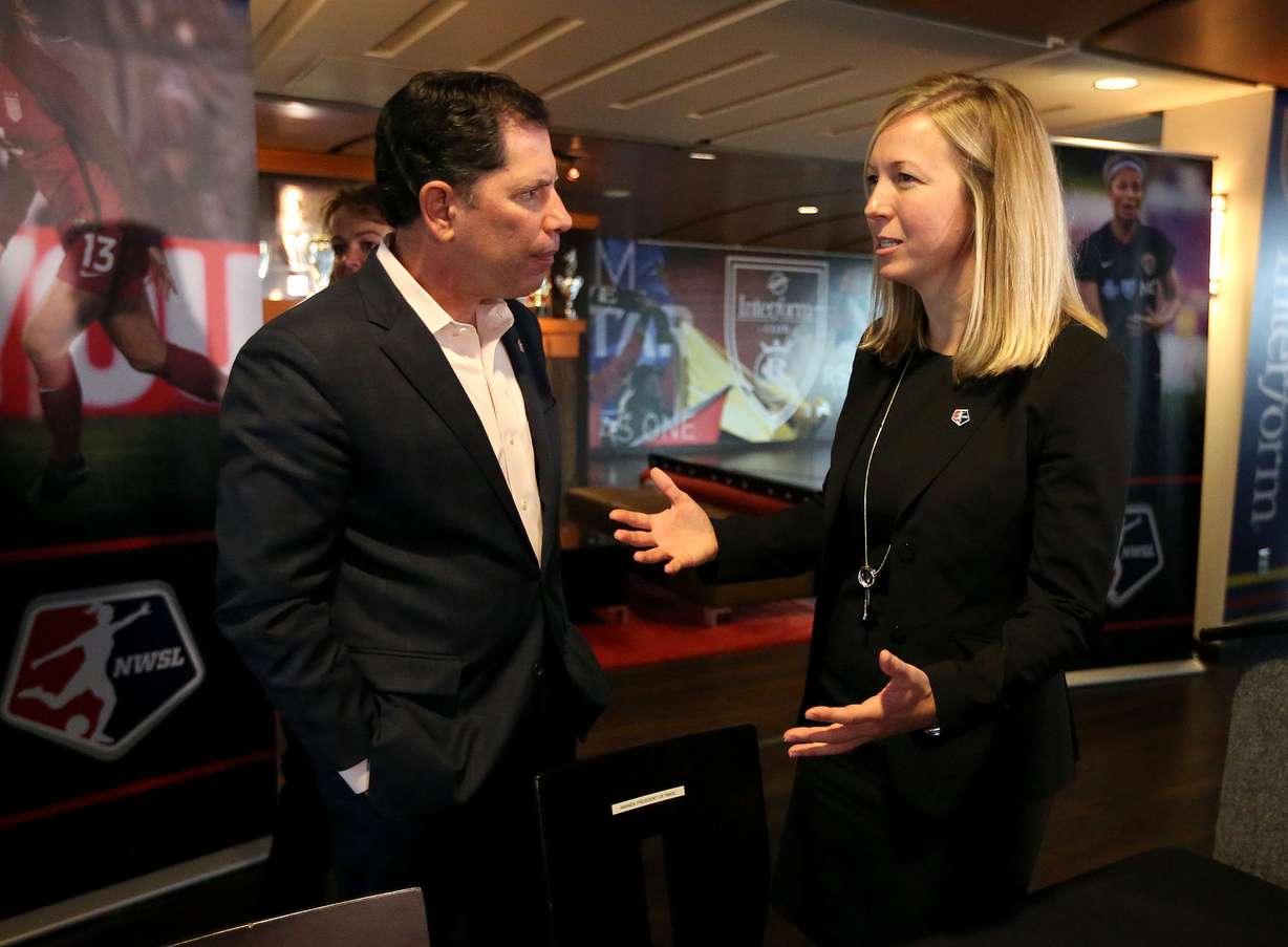 Andy Carroll, Real Salt Lake chief business officer, and Amanda Duffy, managing director of National Women's Soccer League, chat after a press conference announcing a new NWSL team to play in Utah during a press conference at Rio Tinto Stadium in Sandy on Thursday, Nov. 16, 2017.