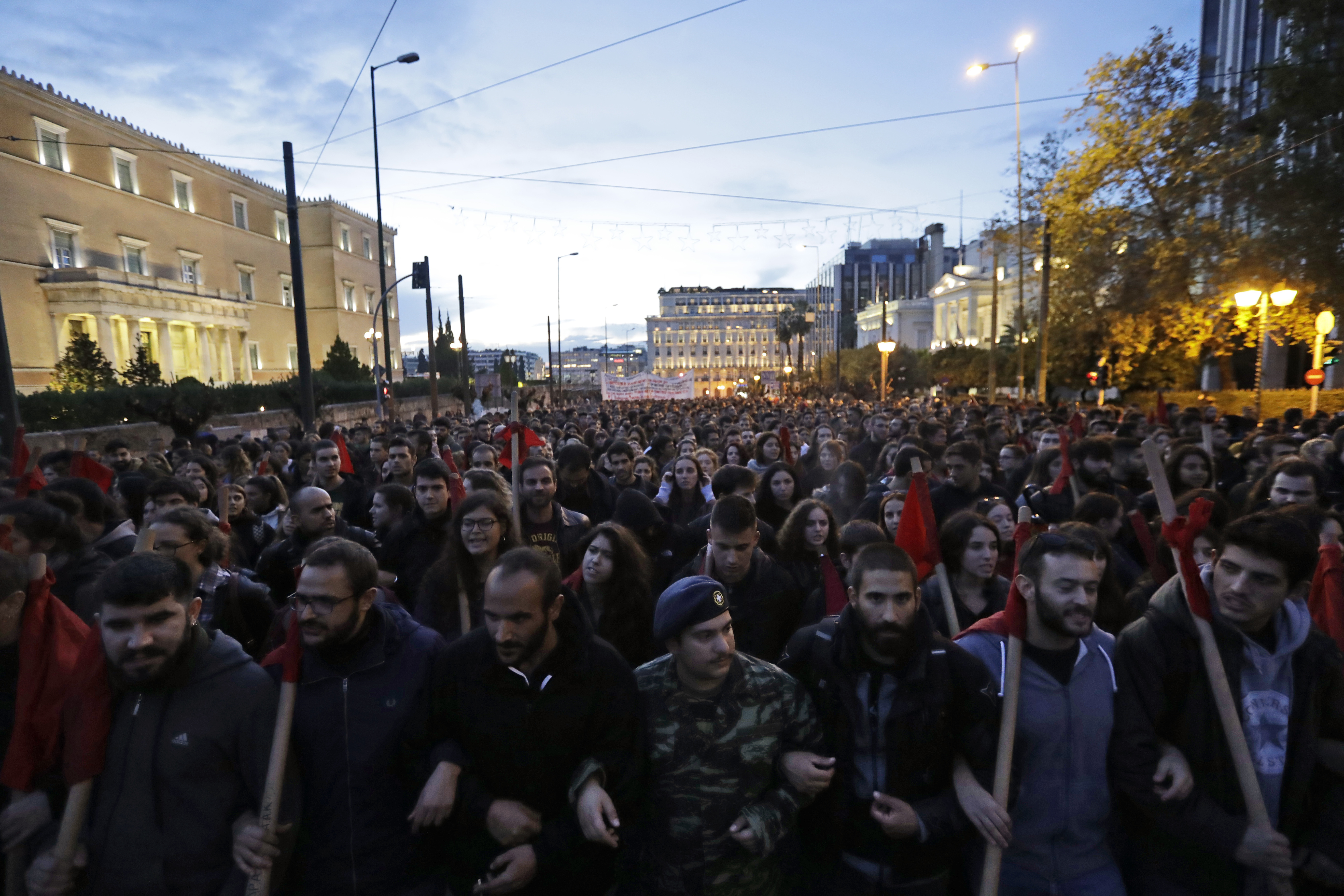The Latest: 2 bystanders hurt in Greek clashes with police