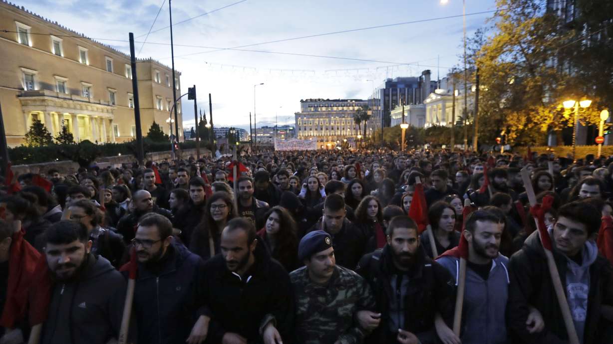 The Latest: 2 bystanders hurt in Greek clashes with police