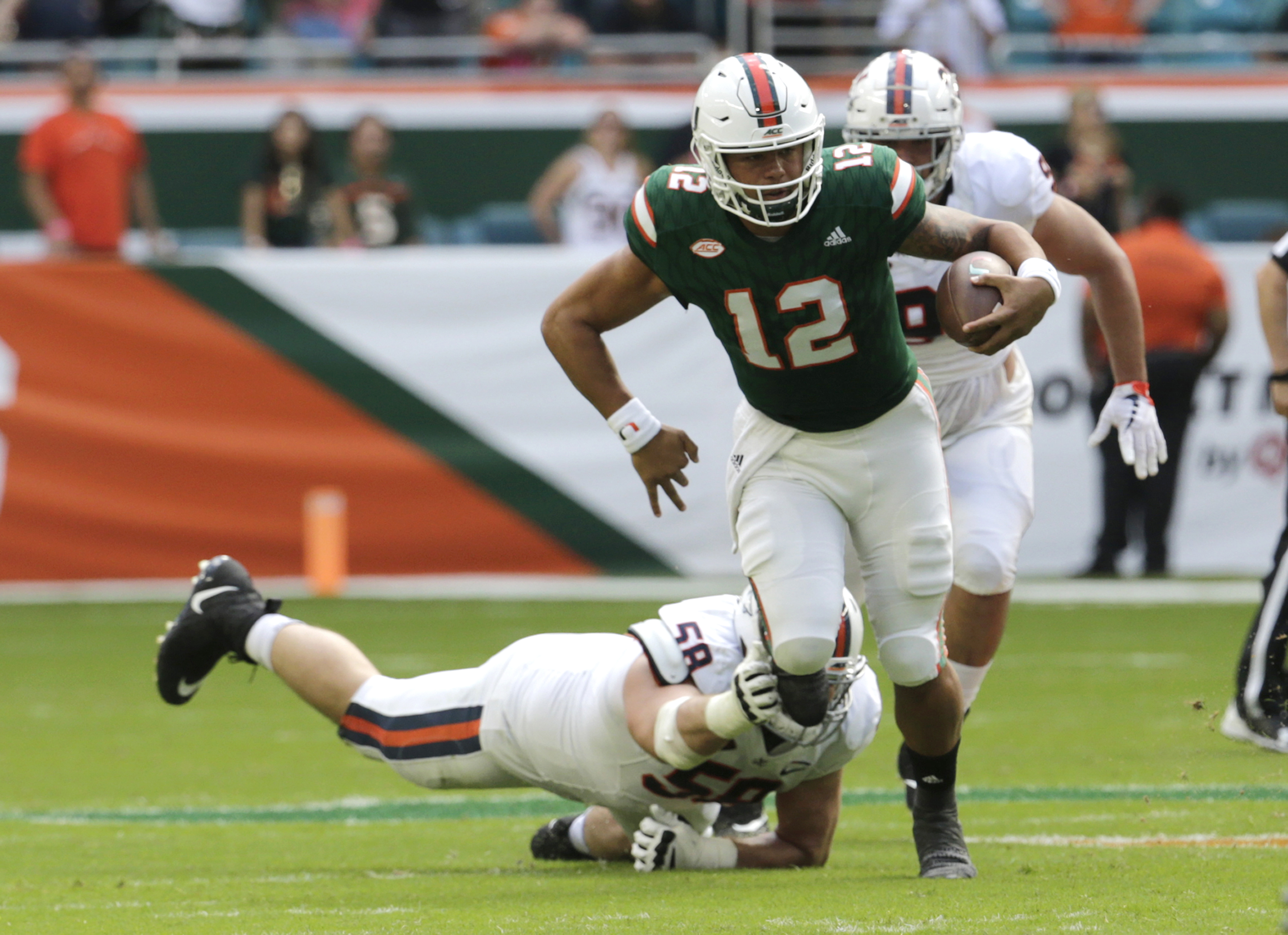 No. 2 Miami finishes on 30-0 run, tops Virginia 44-28