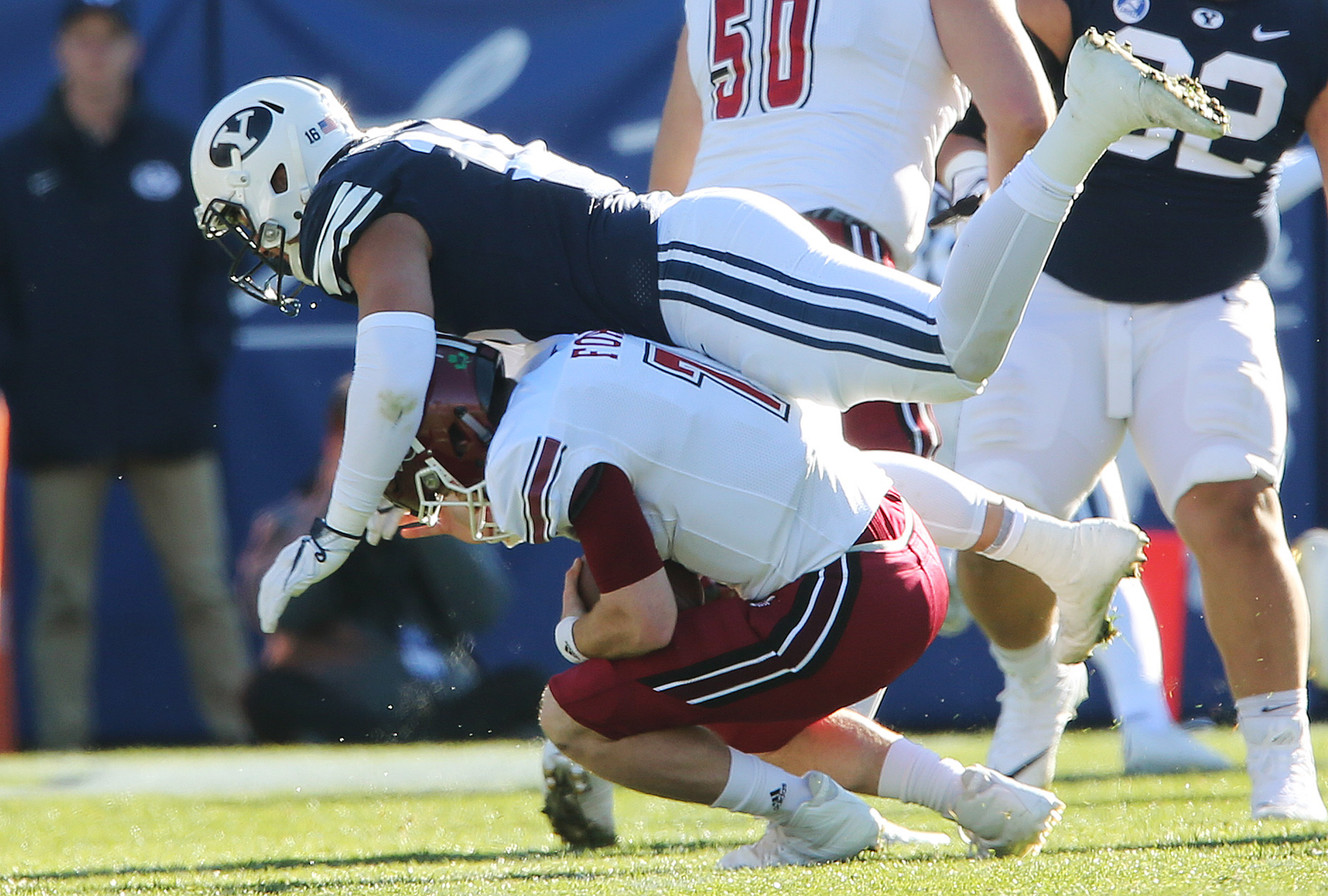 BYU defensive lineman Sione Takitaki (16) sacks Massachusetts Minutemen quarterback Andrew Ford (7) in Provo on Saturday, Nov. 18, 2017. (Photo: Jeffrey D. Allred, Deseret News)
